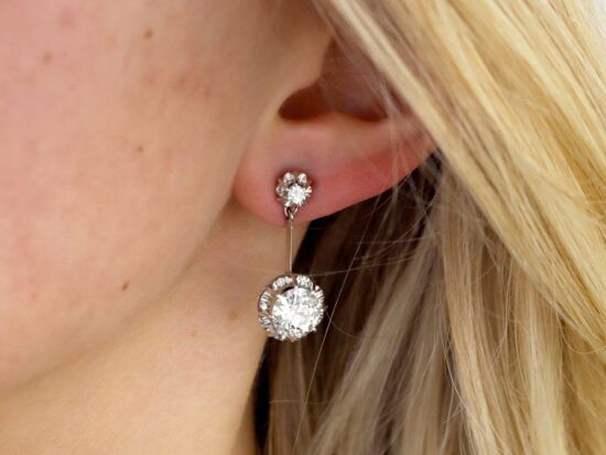 wearing 4.7 carat diamond drop earrings