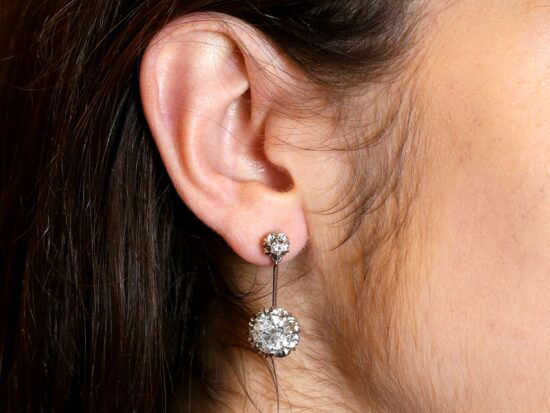 wearing platinum diamond drop earring