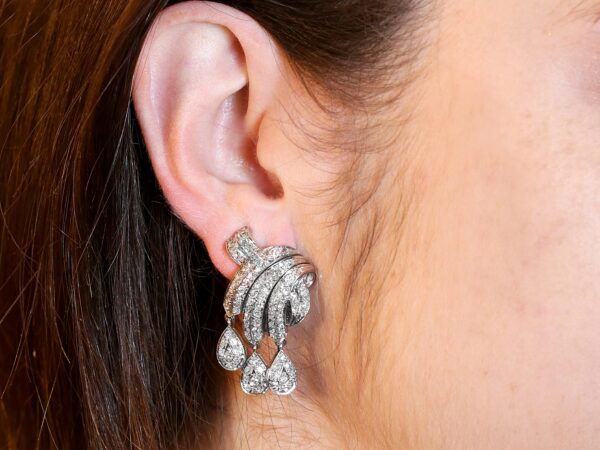 wearing platinum diamond multi drop earrings