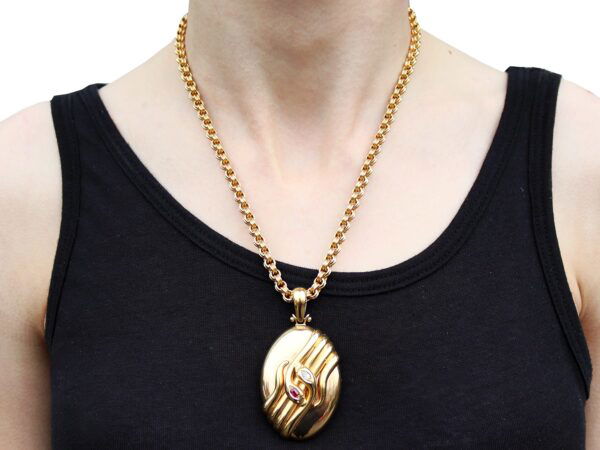 antique gold snake locket wearing