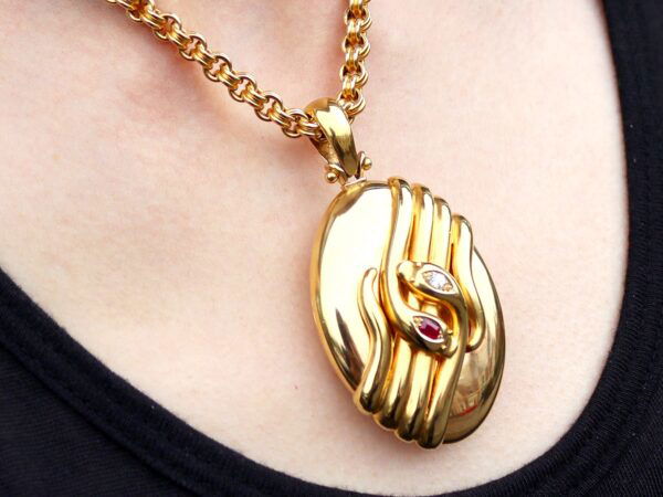 wearing antique gold snake locket