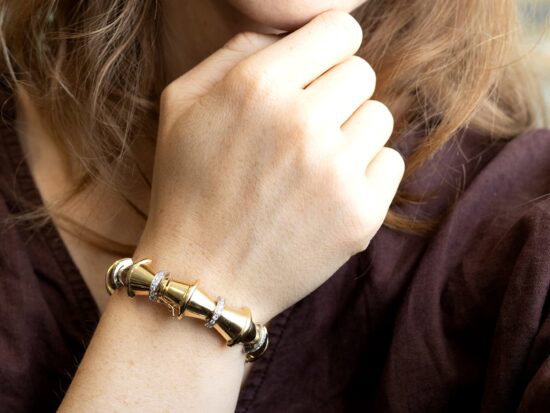 wearing gold and diamond bangle