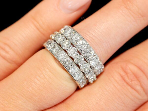 diamond eternity rings stacked on finger