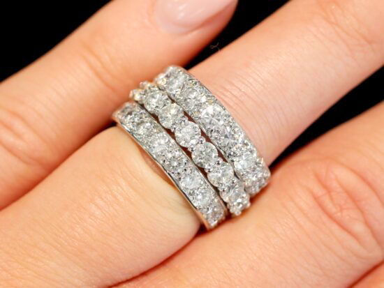diamond eternity rings stacked on finger