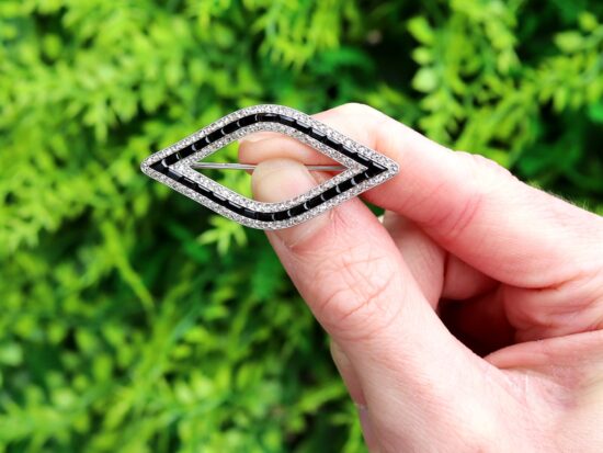 Cartier Black Onyx and Diamond Brooch outside