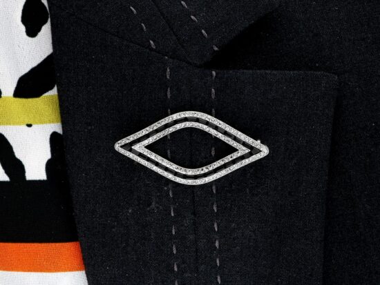 wearing Cartier Black Onyx and Diamond Brooch