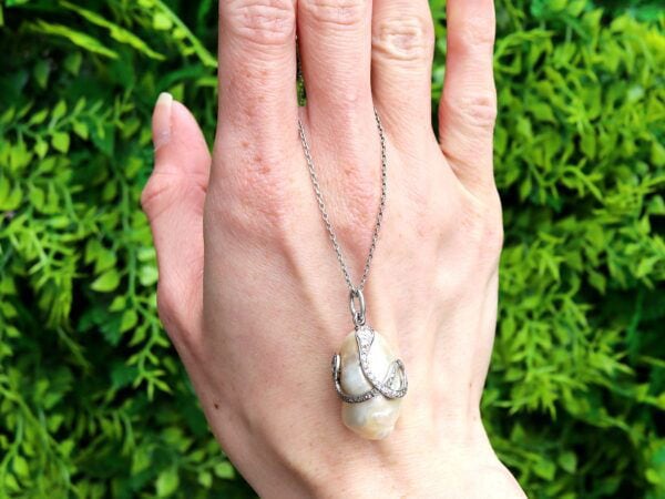 Pearl Diamond and Ruby Snake Pendant outside