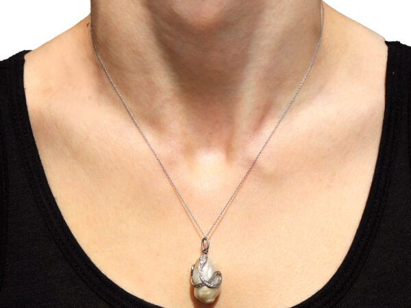 Pearl Diamond and Ruby Snake Pendant on neck
