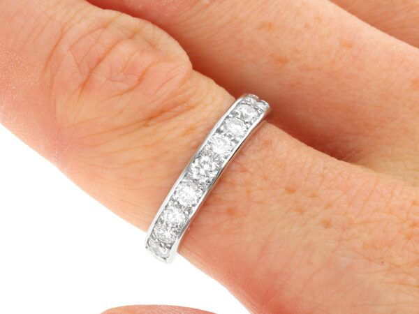 French Pavé Diamond Eternity Ring on finger