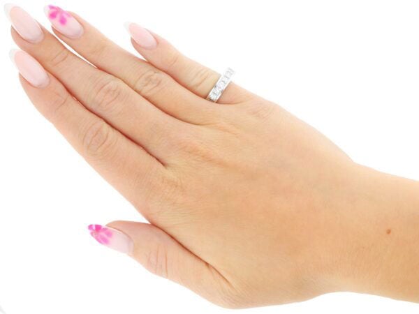 princess cut diamond eternity ring on hand