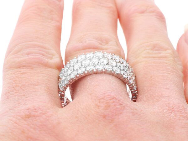 wearing a three row diamond eternity ring