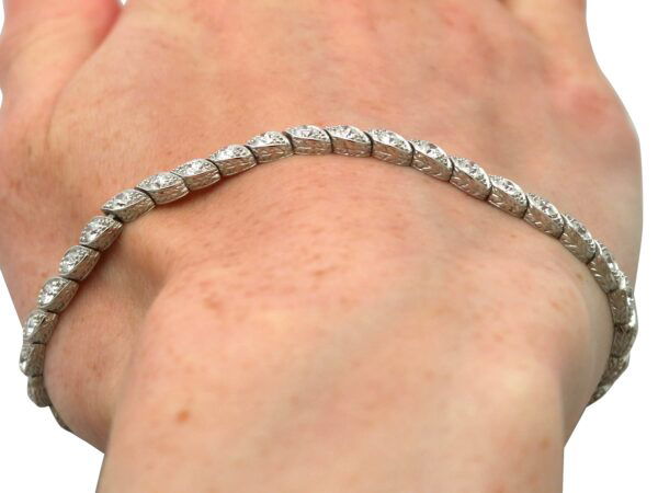 wearing Edwardian diamond tennis bracelet in platinum