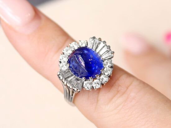 wearing a Burmese sapphire cluster ring
