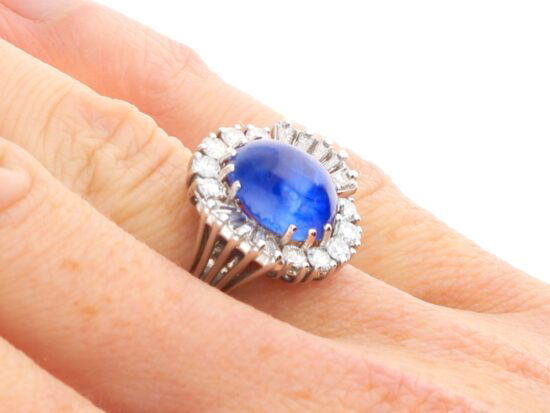 white gold Burmese sapphire ring on finger