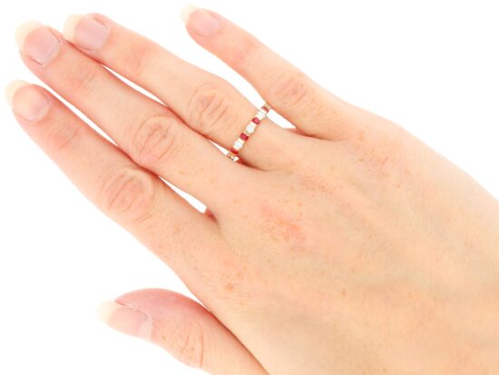 Ruby and Diamond Eternity Ring in Yellow Gold wearing
