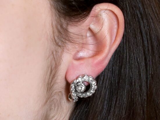 Platinum Earrings On Ear Closeup