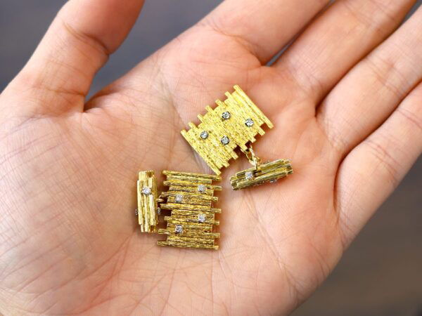vintage 18k gold diamond cufflinks in hand