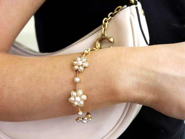 wearing Victorian pearl and 18k gold bracelet