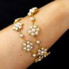 Victorian pearl and 18k gold bracelet on wrist