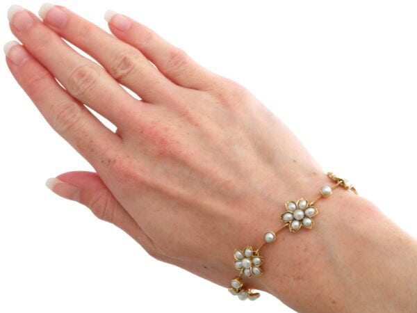 Victorian pearl and gold bracelet on wrist