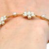 Victorian pearl and gold bracelet on arm