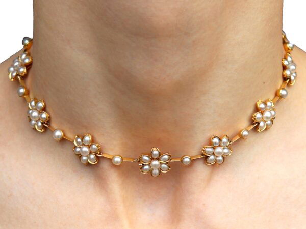 Victorian pearl and gold necklace on neck