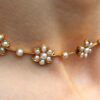 wearing Victorian pearl and gold necklace