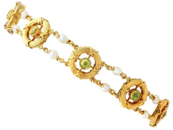 A stunning, fine and impressive antique peridot, natural pearl and 15 carat yellow gold bracelet; part of our diverse antique jewellery and estate jewelry collections. SKU: C8949