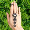 black diamond and pearl pendant outdoors