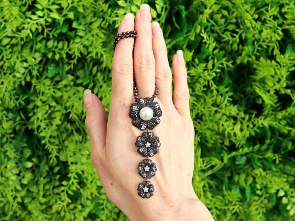 black diamond and pearl pendant outdoors