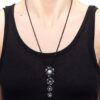 wearing black diamond and pearl pendant