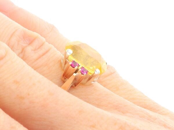 Yellow Sapphire Ring with Rubies in Gold on hand