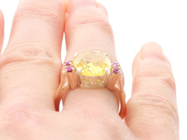 Yellow Sapphire Ring with Rubies in Gold on finger