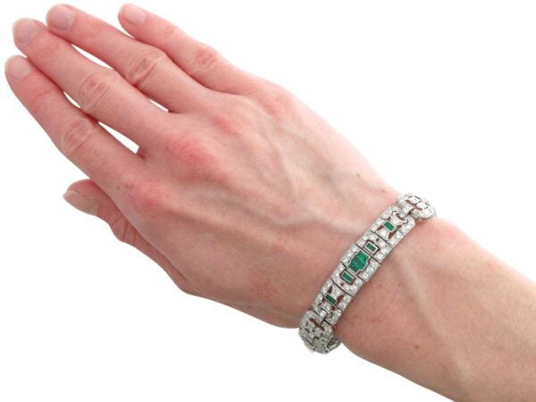 1920s platinum emerald and diamond bracelet on hand