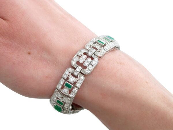 1920s platinum emerald and diamond bracelet on arm