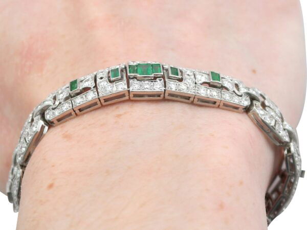 1920s platinum emerald and diamond bracelet on wrist