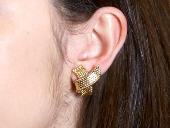 Mauboussin Gold Earrings Being Worn