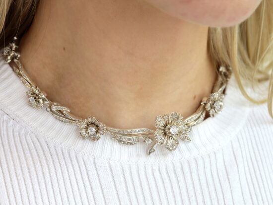 antique floral diamond necklace on neck