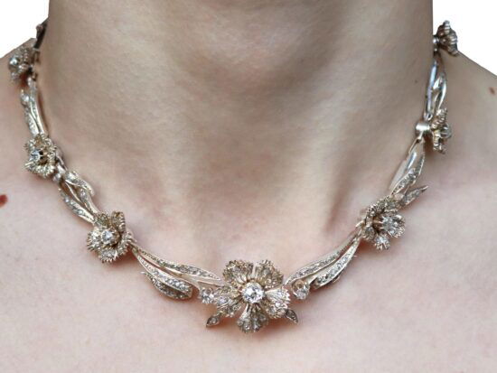 diamond floral necklace on the neck