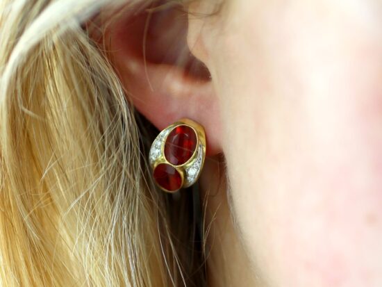 Fire Opal Earrings Being Worn