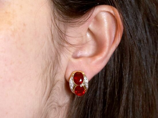 Fire Opal and Diamond Earrings Being Worn