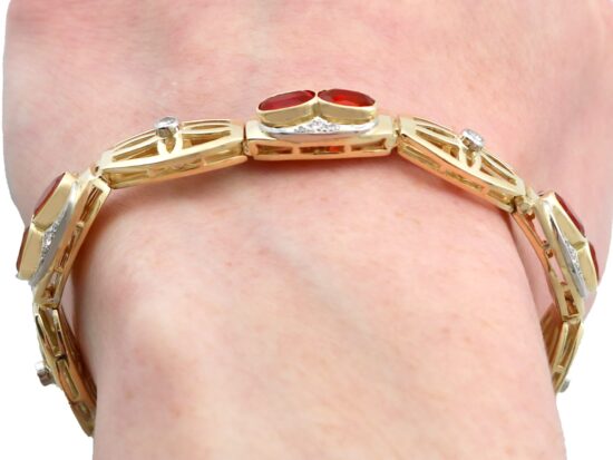 Fire Opal and Diamond Bracelet Being Worn Close Up