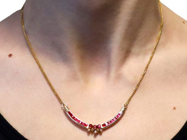 wearing vintage yellow gold and ruby necklace