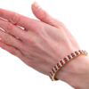 wearing ruby and diamond bracelet on hand
