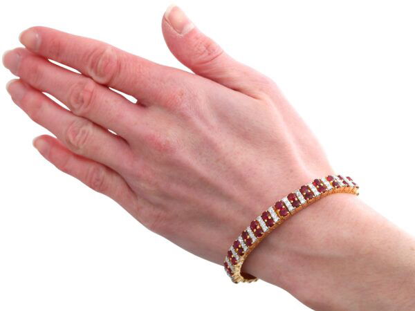 wearing ruby and diamond bracelet on hand