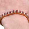 wearing ruby and diamond bracelet
