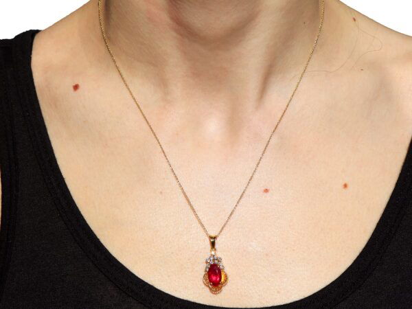 wearing Vintage Ruby Pendant in Gold