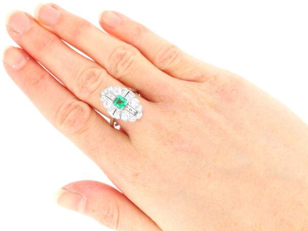 wearing art deco emerald and diamond ring