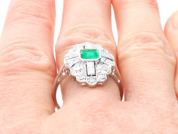 wearing emerald and diamond ring