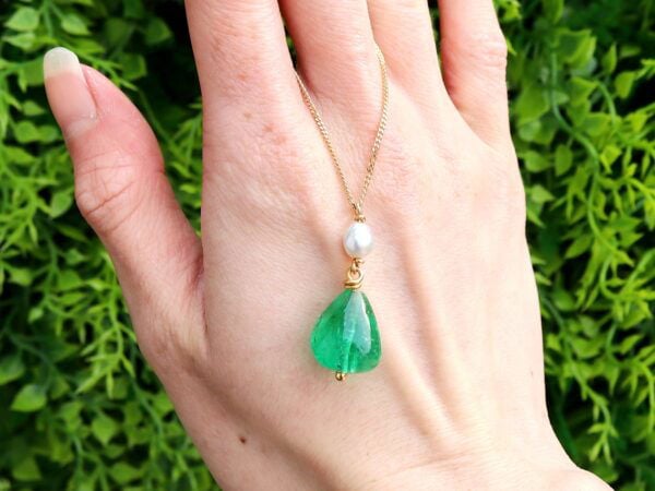 GIA certified emerald pendant with pearl outside